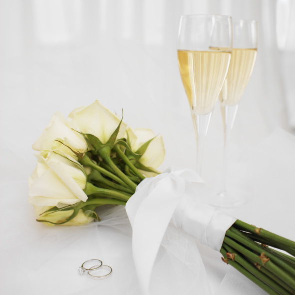 high angle view of a bouquet of flowers with two champagne flutes